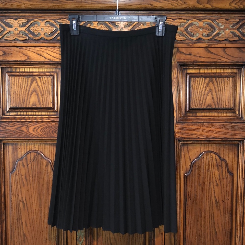 Another swingy skirt with pleats that stretched when you eat.